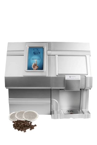 A modern coffee pod machine with a digital touchscreen display, coffee pods, and coffee beans arranged in front of the unit.