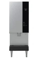 A commercial ice dispenser with a stainless steel exterior, control buttons, a dispensing area, and four metal legs.