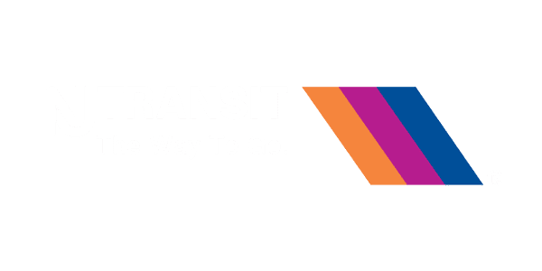 NJ Transit logo with the text "The Way To Go." and three diagonal stripes in orange, purple, and blue on a light gray background.